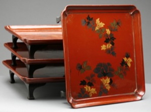 A Set of Three Asian Red-Lacquer Footed Square Trays